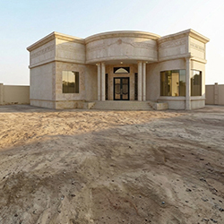 Photo of an empty sandy villa backyard
