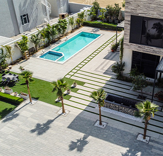 Hardscaping with landscape pavers for villa outdoor living areas in Dubai.